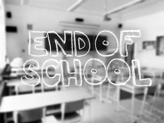 A chalk lettering with a blurred classroom