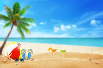 summer accessories on sandy beach