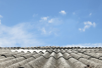Old tiles roof under blue sky