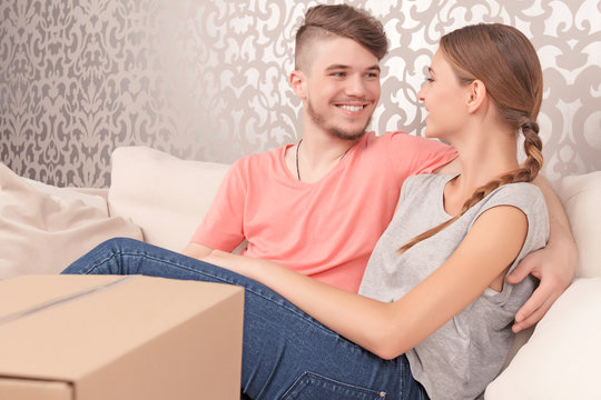 Young couple siting on sofa 