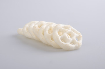 Junk food, potato ring on a background