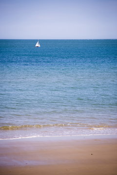 Sailing boat, seen from Swanage Beach, Dorset 