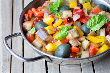  cooked vegetable salad made from chopped fried eggplant. Traditional sicilian dish.