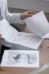 Doctor working with test results