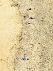 beach with tourists in summer in Arrecife, Spain