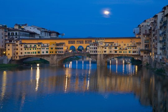 Ponte Vecchio bridge over the River Arno and full moon, Florence, Tuscany