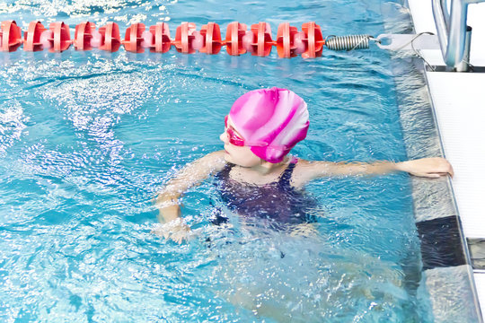 Girl in pink rubber hat