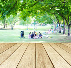 Perspective wood with blurred people activities in park backgrou