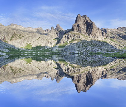 Pic Lombarduccio reflecting in Lac de Melo, Gorges de la Restonica, Haute Corse, Corsica, France