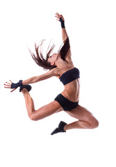 Stylish and young modern style dancer jumping 