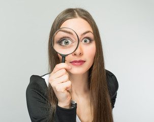 beautiful girl with a magnifying glass