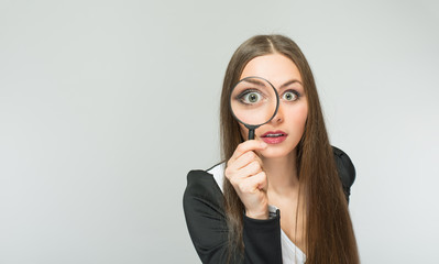 beautiful girl with a magnifying glass