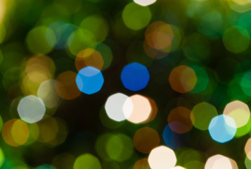 Obraz premium dark green blurred shimmering Christmas lights