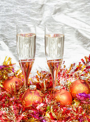 Fototapeta na wymiar glasses of champagne with gold Xmas decorations