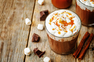 hot dark chocolate with whipped cream, cinnamon and salted caram
