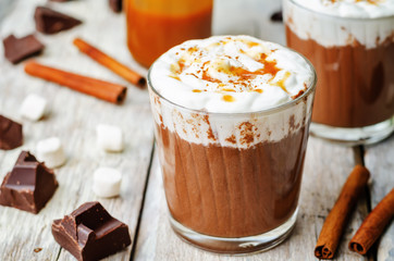 hot dark chocolate with whipped cream, cinnamon and salted caram