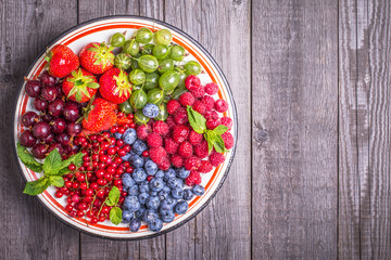 Set of summer berries on a wooden background