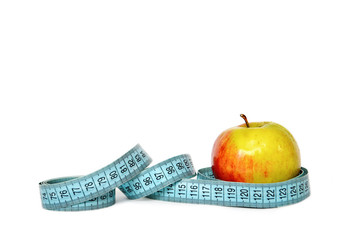 Apple and measuring tape isolated on white background