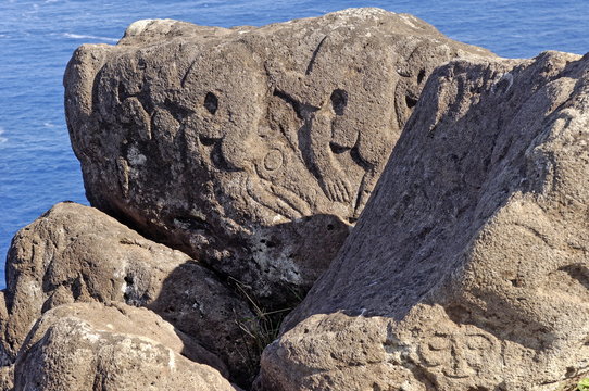 Petroglyphs with birdman images beside the lake in a crater at Orongo, Easter Island, Chile