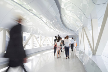 Business people walking in the office corridor.