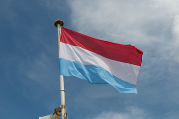 Flag of paraguay under blue sky
