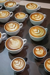 Many cup of  cappuccino coffee.