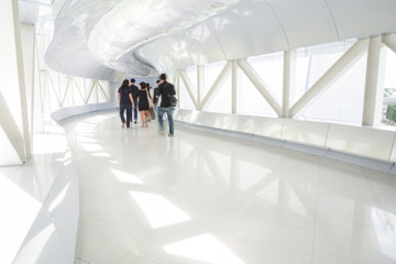Business people walking in the office corridor.
