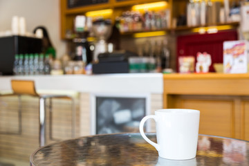 Coffee cup on table in cafe