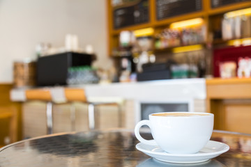 Coffee cup on table in cafe