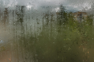 Raindrops on glass. Sorrow.