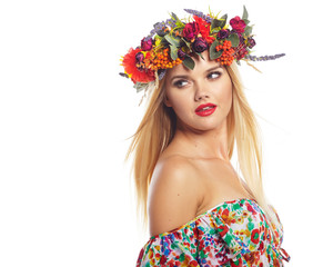 Fototapeta na wymiar Slavic blonde girl in the flowers wreath