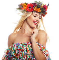 Fototapeta na wymiar Slavic blonde girl in the flowers wreath