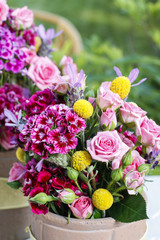 Romantic floral arrangement with roses and carnations
