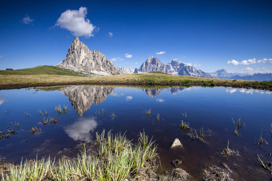 The Gusela peak and the Tofane Group by Cortina D'Ampezzo reflecting in the lake by Passo Giau, Veneto
