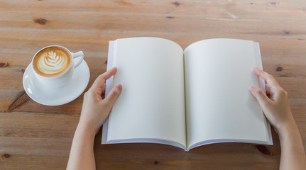 Hands open Blank catalog, magazines,book mock up on wood table w