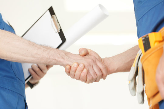workmen handshake