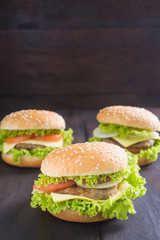 Delicious homemade hamburger on wooden desk.