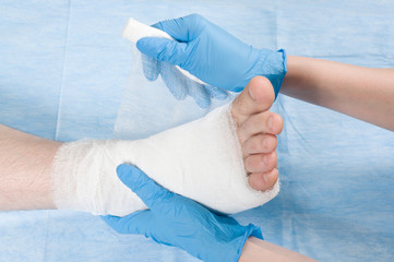 doctor bandages leg