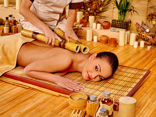 Obraz na płótnie Canvas Woman getting bamboo massage.
