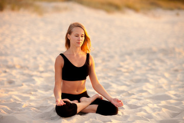 Fototapeta na wymiar Meditation yoga on a beach
