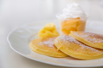 Pan cake with ice cream on table
