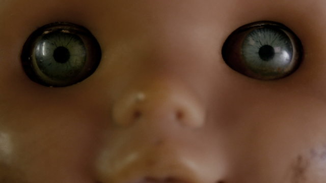Creepy Doll. Close-up of doll, turning forward.
