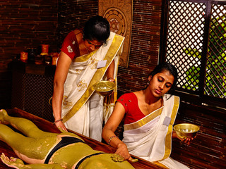 Woman having Ayurvedic body  spa massage.