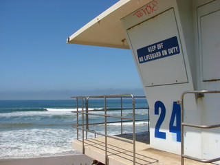 lifeguard tower overlooking ocean - Powered by Adobe