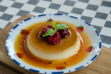 caramel custard dessert and red berry with honey