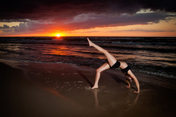 Fototapeta na wymiar Beach yoga session by polish sea