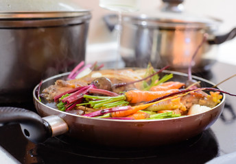Healthy dinner simmering in a pan