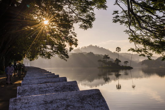 Sunrise at Kandy Lake and the island which houses the Royal Summer House, Kandy, Central Province, Sri Lanka