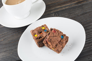 brownies in plate on wood table