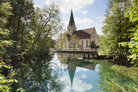 Church of Blaubeuren Monastry reflecting in Blautopf Spring, Blaubeuren, Swabian Alb, Baden Wurttemberg, Germany